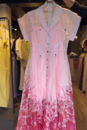 Elegant Blush Pink A-Line Shirt Dress with Floral Hem and Utility Pocket Detail – Lightweight Semi-Sheer Cotton Blend with Full Front Button Closure and Dual Chest Flaps – Perfect for Spring Brunches & Summer Daywear 🌺👗"