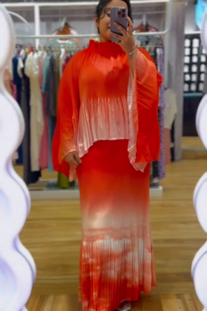 "Fiery Ombre Red to Peach Pleated Maxi Co-Ord Set with Flowing Cape Sleeves and High Ruffled Neck – Luxe Crepe Satin Blend with Fluid Movement for Festive, Resort, or Statement Wear 🌅👑"